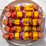 Enjoy grilled Savory Skewers: Chimney Stack Sausage and Cheese: warm sausage and melty cheese.