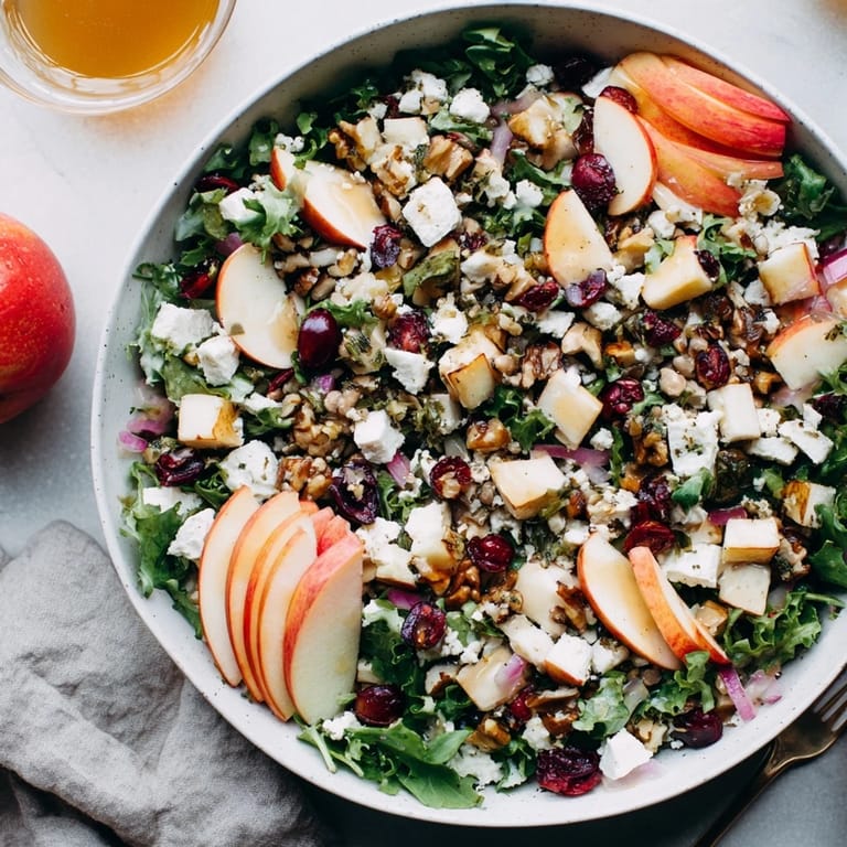 Freshly tossed Chicken and Apple Winter Salad with colorful apple slices, inviting you in for a taste.